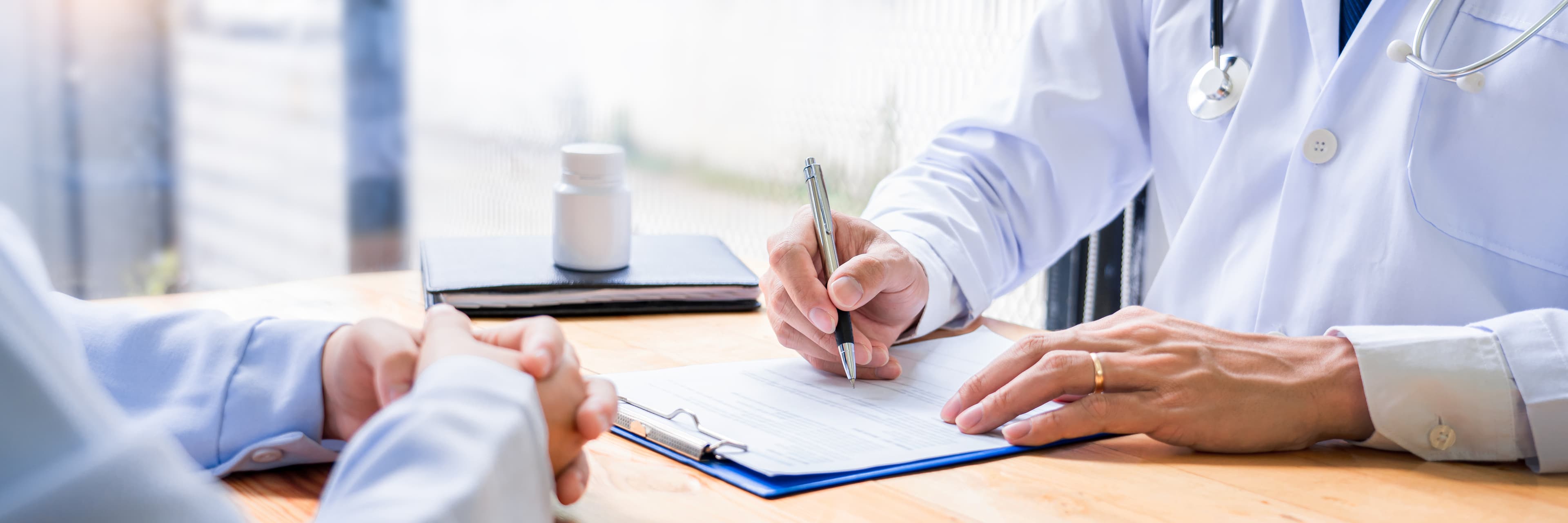 Physician consulting patient